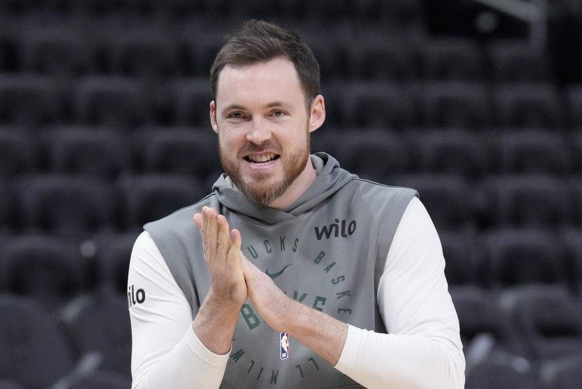 Pat Connaughton (24) walks onto the court for pregame warmups before a game against the San Antonio Spurs at Fiserv Forum. 