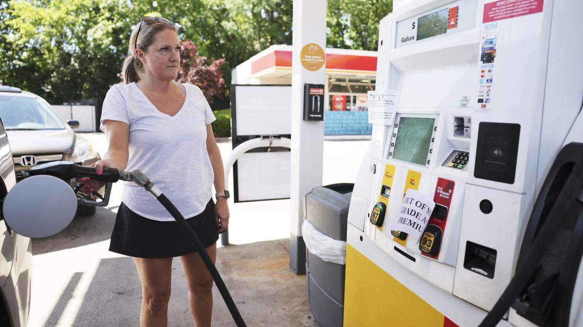 Amy Williams gets gas at the Circle K on Randolph Road in Charlotte, N.C., on Thursday, May 13, 2021. Price per gallon of Regular gas is $2.89.