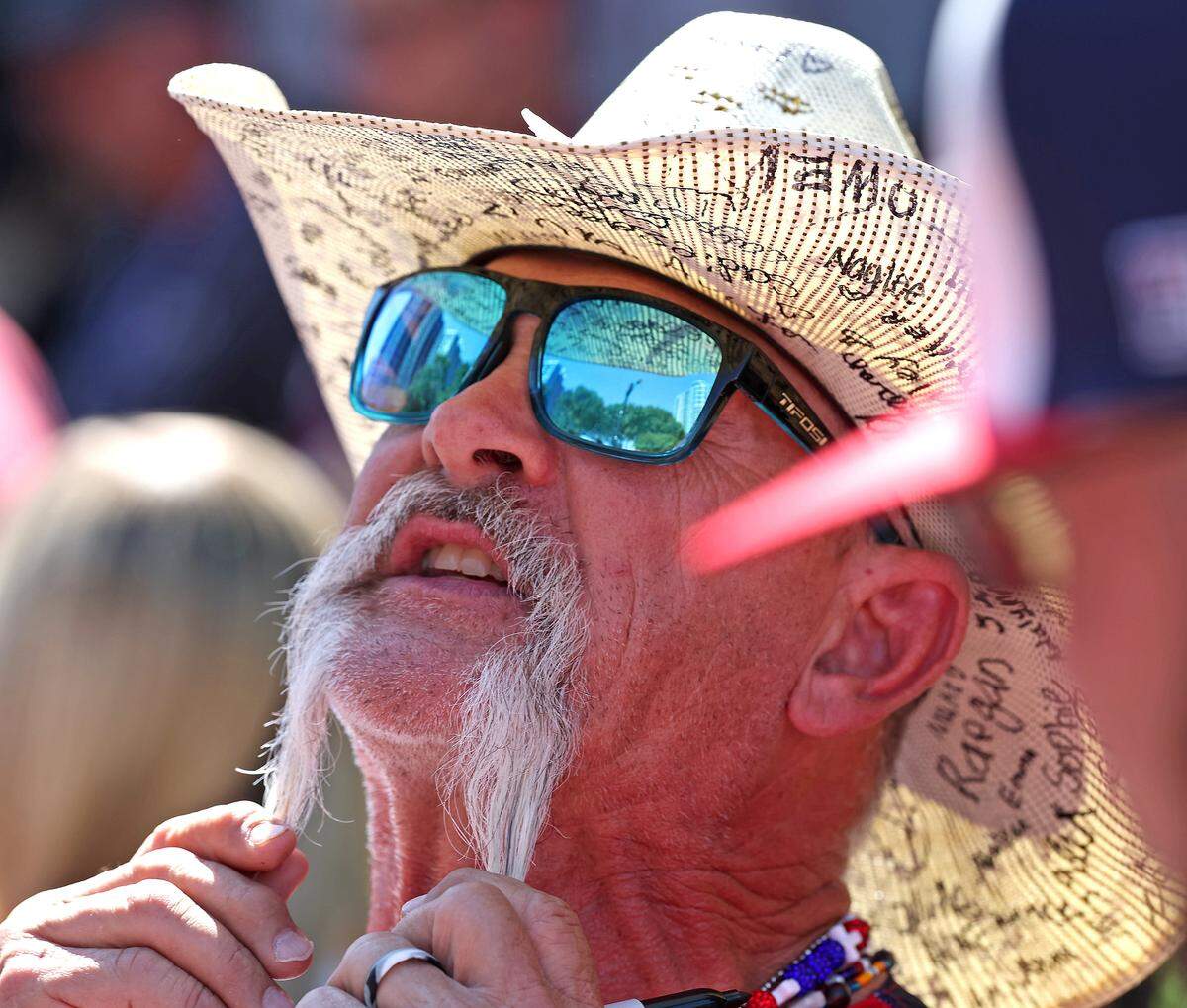 Texas Tailgaters manager Joe Mikulik pulls on his mustache for fans outside Truist Field in Charlotte, NC on Thursday, June 4, 2026. Fans packed Truist Field for Banana Ball action between the Texas Tailgaters and Firefighters. Mikulik managed the Asheville Tourists from 2000-2012.