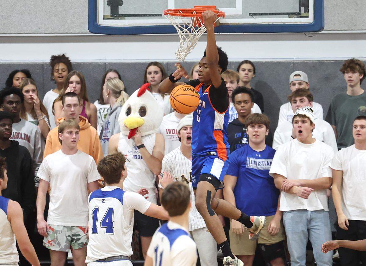 Lake Norman Christian’s DJ Todd throws down a dunk during action against Charlotte Christian on Tuesday, November 12, 2024.