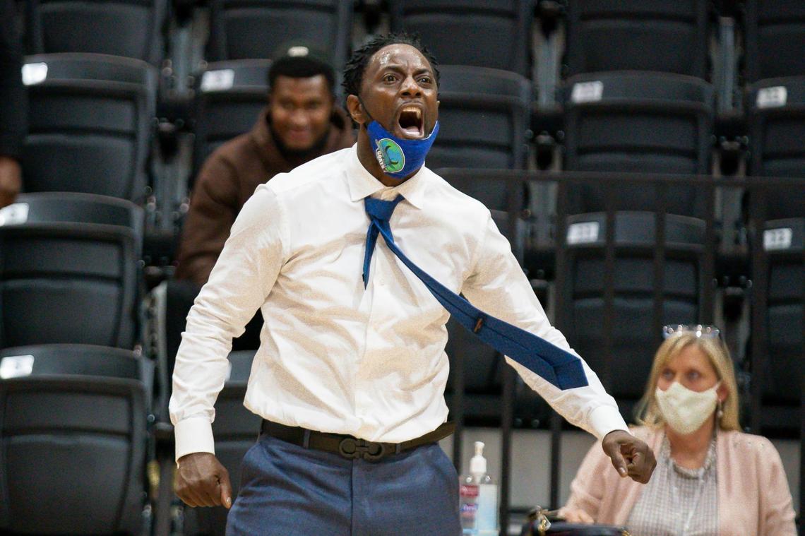 Combine Academy head coach Jeff McInni (center) celebrates the come back win vs Bull City National.