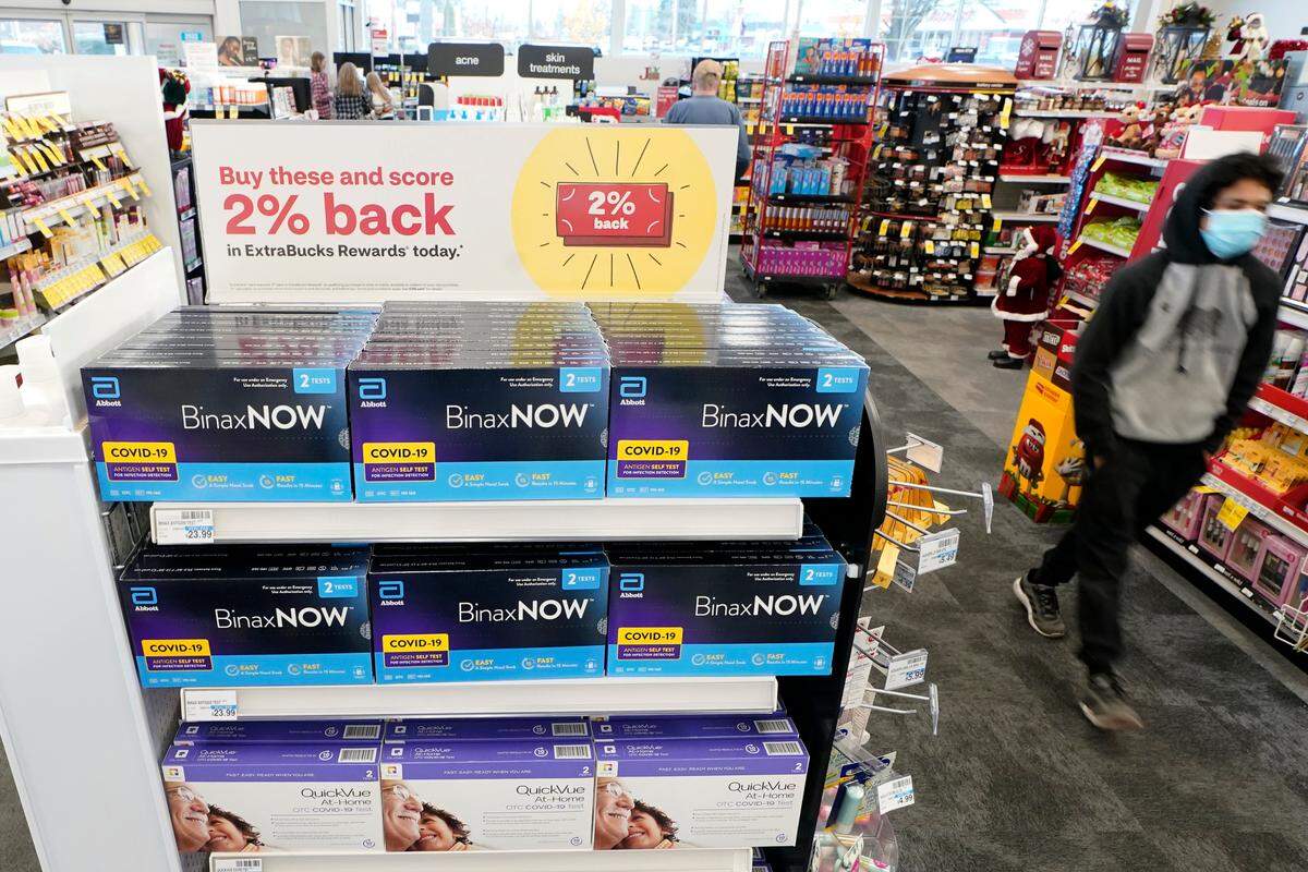 Boxes of BinaxNOW and QuickVue home COVID-19 tests are shown for sale Monday, Nov. 15, 2021, at a CVS store in Lakewood, Washington. Mecklenburg County Public Health will offer free COVID-19 at-home test kits on Saturday, Jan. 29, 2022.