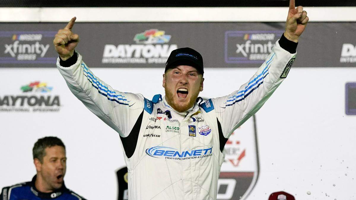 Austin Hill celebrates in Victory Lane after winning a NASCAR Xfinity Series auto race at Daytona International Speedway, Saturday, Feb. 19, 2022, in Daytona Beach, Fla. (AP Photo/John Raoux)
