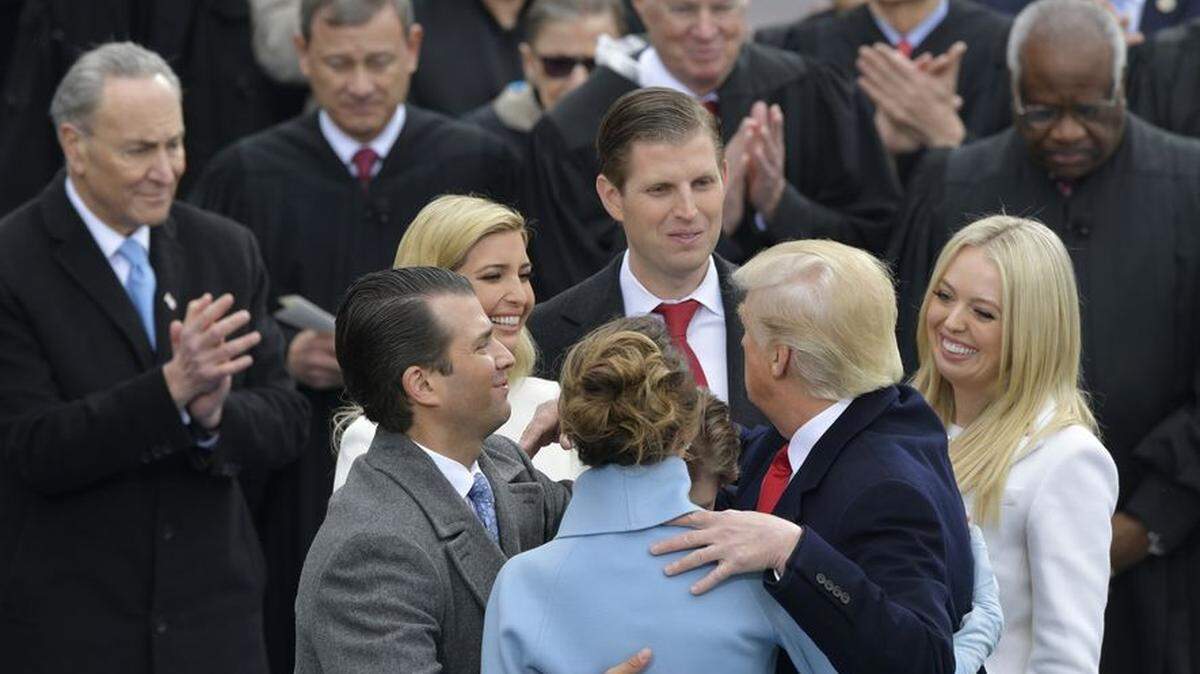 President Donald Trump hugs his family after taking the oath of office during the 58th Presidential Inauguration at the U.S. Capitol in Washington, Friday, Jan. 20, 2017. (AP Photo/Susan Walsh)
