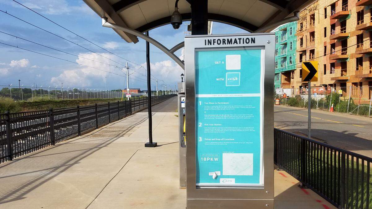 A sign explains the CATS-Lyft partnership at the Parkwood Station.