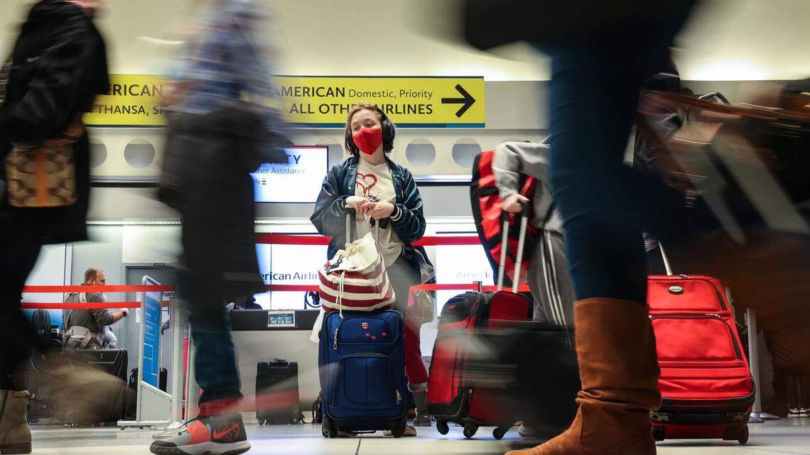 With several flights being canceled and planes being grounded, people wait at Charlotte Douglas International Airport during one of the busiest days for holiday travel on Friday, December 23, 2022.