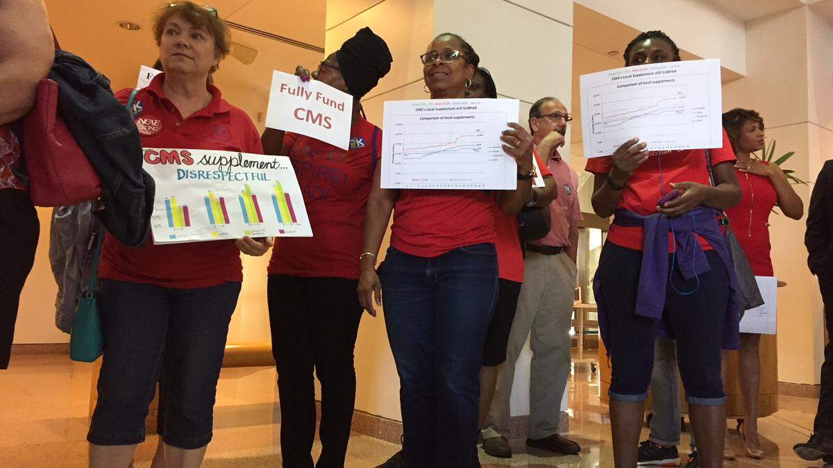 Teachers and other supporters wearing "Red for Ed" packed a June 4 public hearing to urge Mecklenburg commissioners to give CMS a $40 million increase that would include local raises for teachers.