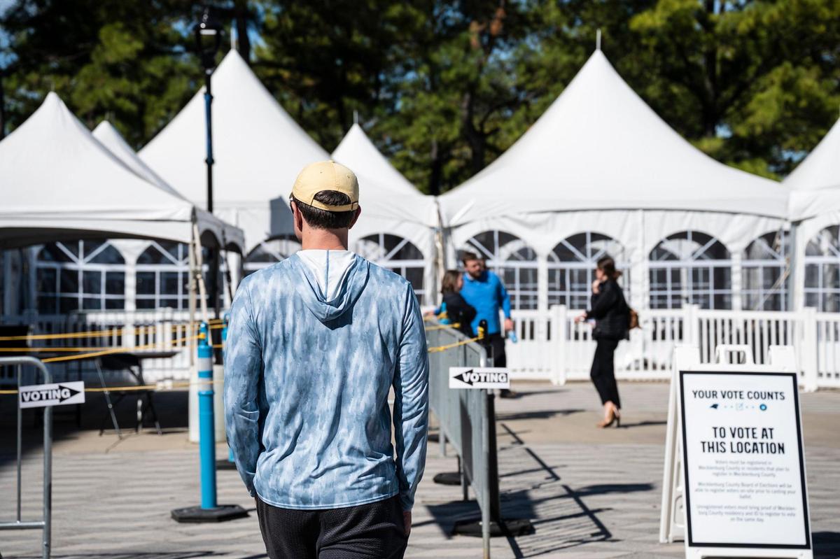 People arrive to vote early at the Bank of America Stadium voting site on Thursday, October, 20, 2022.