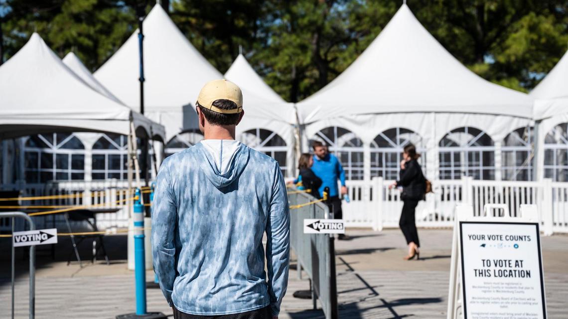 People arrive to vote early at the Bank of America Stadium voting site on Thursday, October, 20, 2022.
