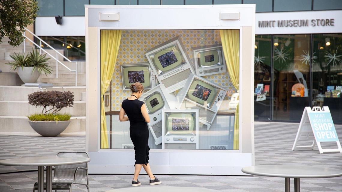 A 12-foot tall, 4,000-pound multidimensional diorama called “Tune In” sits in front of the Mint Museum at Wells Plaza in uptown Charlotte.