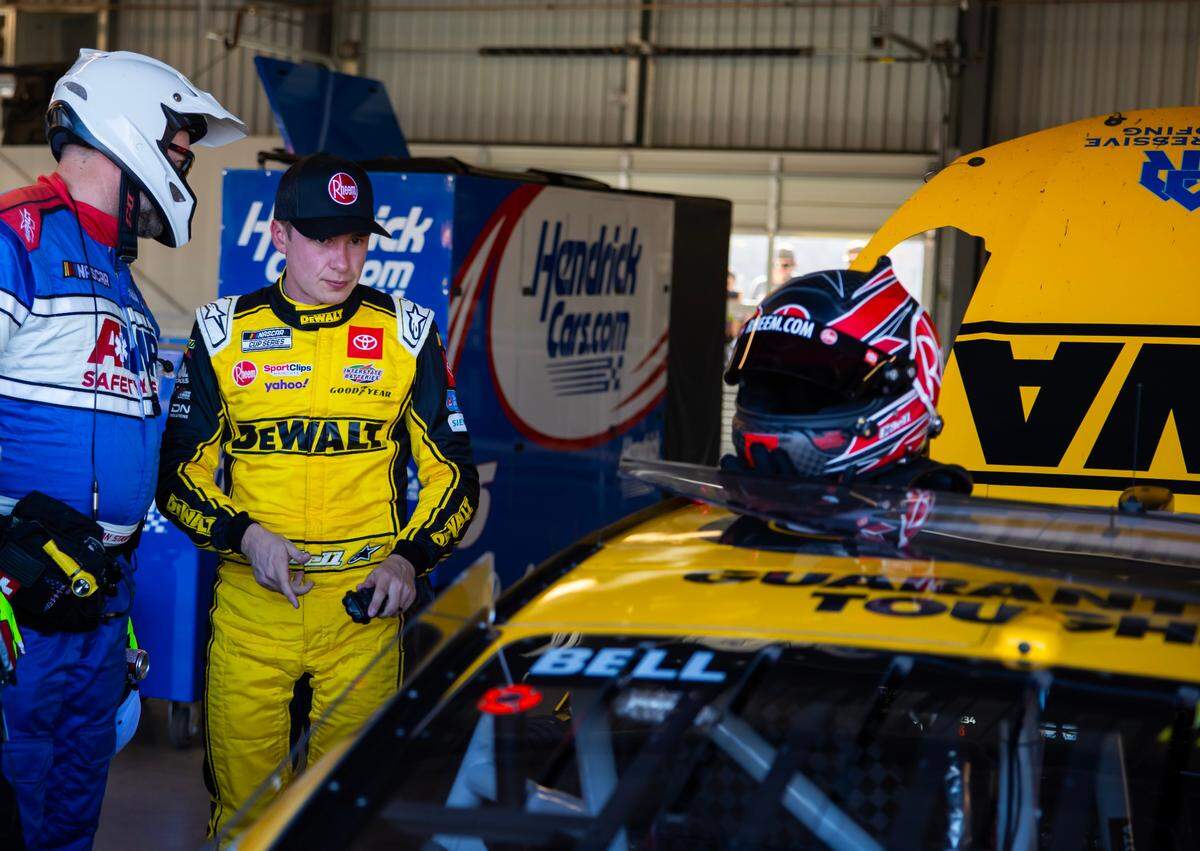 Nov 5, 2023; Avondale, Arizona, USA; NASCAR Cup Series driver Christopher Bell reacts in the garage after crashing out of the Championship Race at Phoenix Raceway. Mandatory Credit: Mark J. Rebilas-USA TODAY Sports