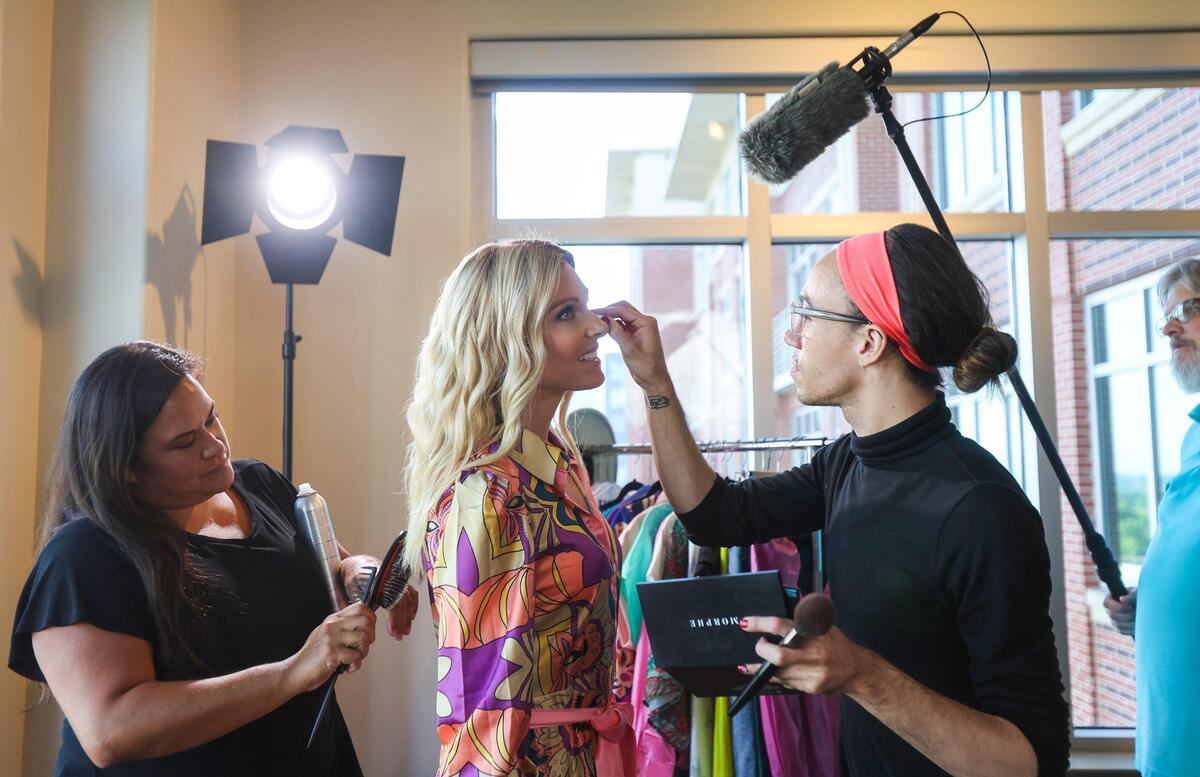 Anna Kooiman gets her hair and makeup touched up during a promotional photo shoot for her forthcoming show earlier this month.