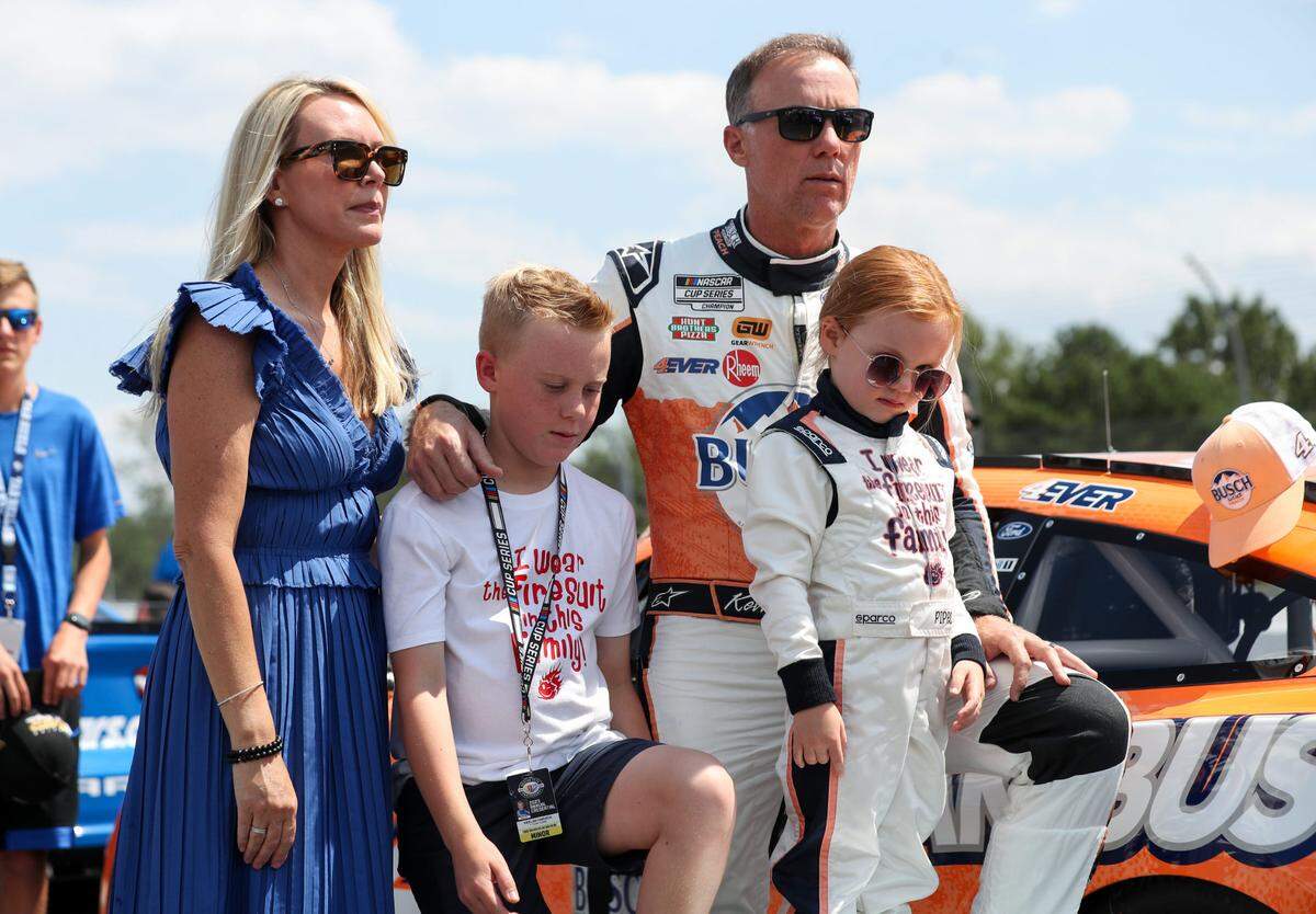 Jul 23, 2023; Long Pond, Pennsylvania, USA; NASCAR Cup Series driver Kevin Harvick stands with his wife DeLana Harvick and son Keelan and daughter Piper prior to the HighPoint.com 400 at Pocono Raceway.