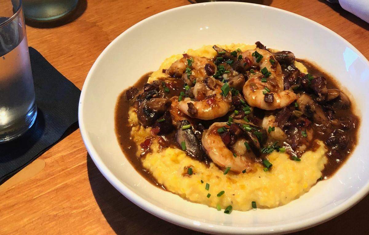 New South Kitchen’s Shrimp and Grits features house made sausage, mushrooms and Bost Mill grits ($19).