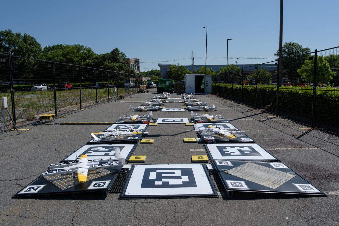 Wings drones land on chargers after making a DoorDash delivery.