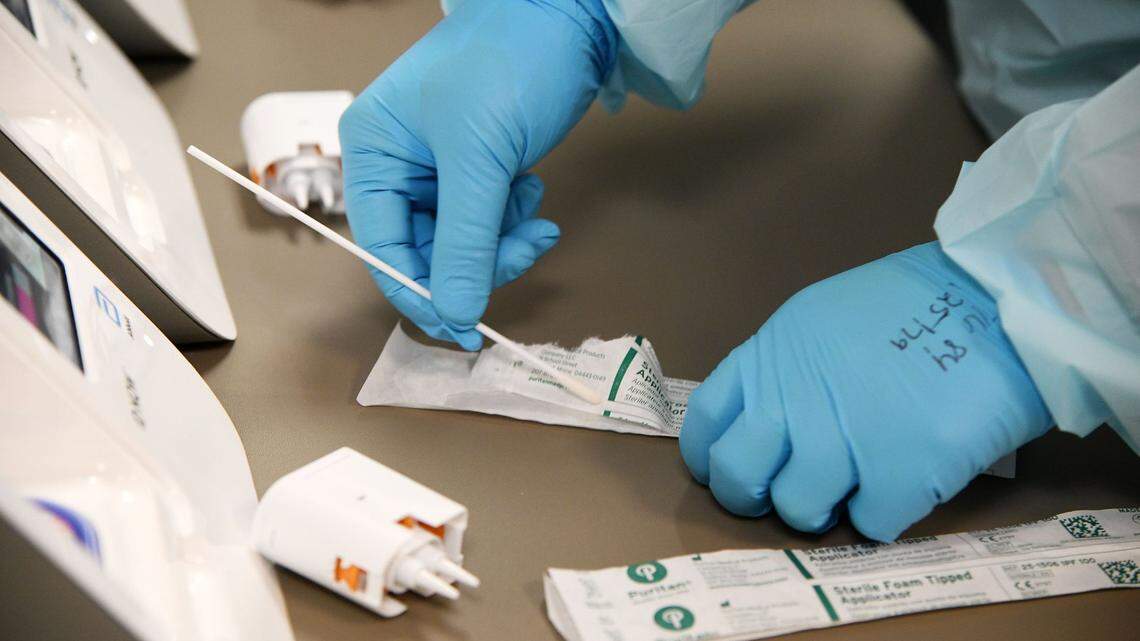 Medical technician Casey Dews runs tests for flu, RSV and Strep on a sample taken from a person outside in their car who does not feel well. Chesapeake ERgent Care, in Gambrills. A child died and another was hospitalized in Mecklenburg County after getting strep infections in May.