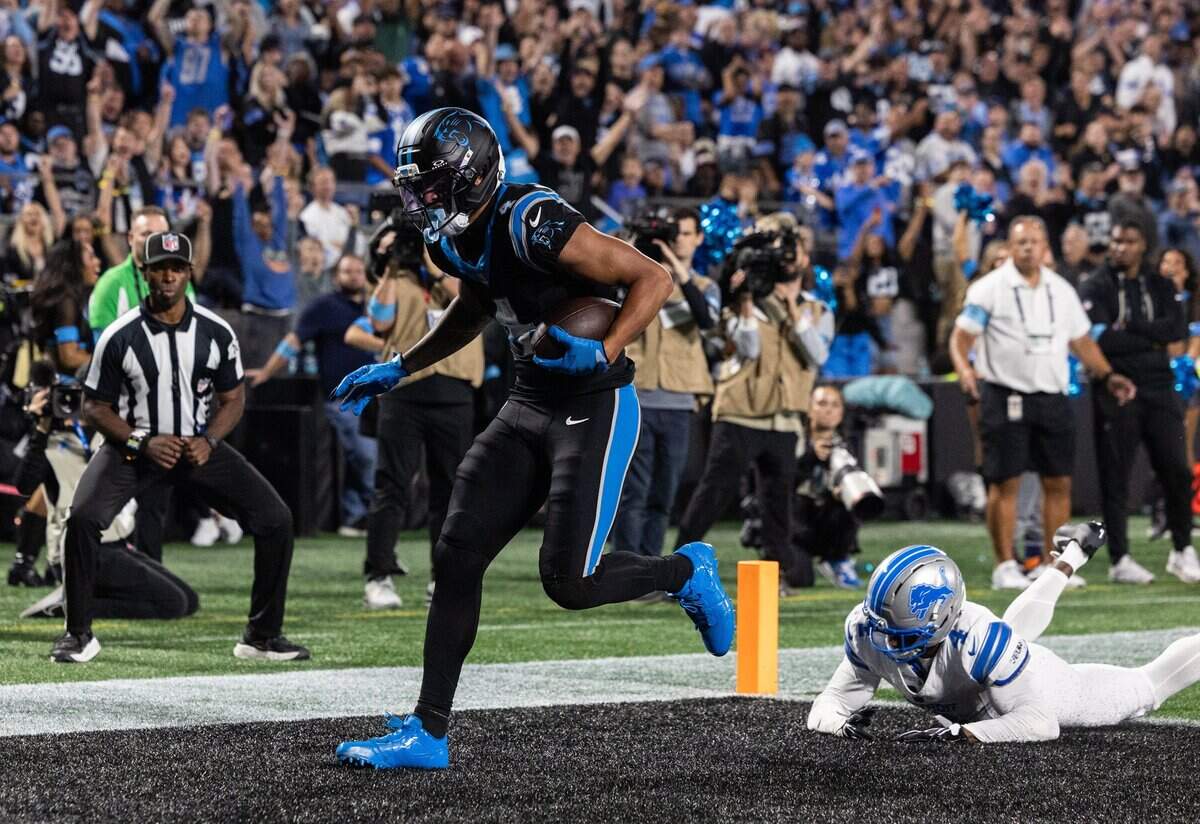 Panthers wide receiver Tetairoa McMillan runs the ball into the end zone for a touchdown during the game against the Lions at Bank of America Stadium in Charlotte on Sunday, October 4, 2026.