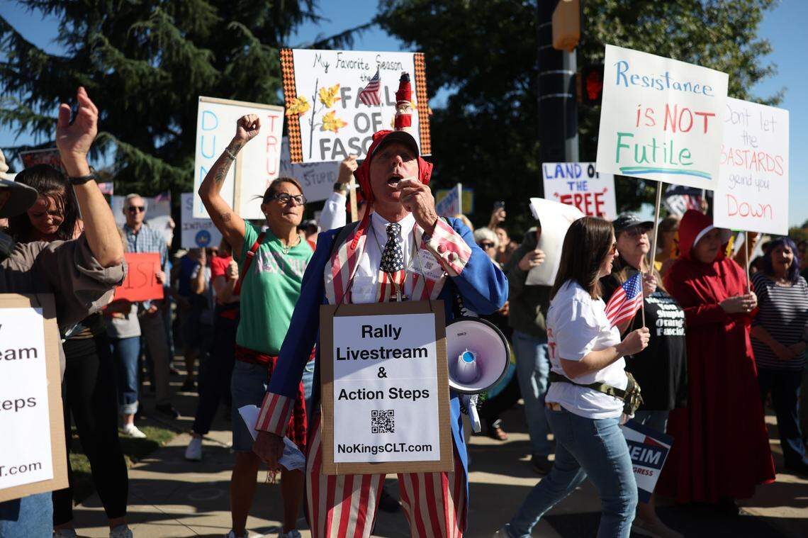 Protesters begin the ‘No Kings’ rally in First Ward Park in Charlotte on Saturday, Oct. 18. The rally turned into a march through Uptown.
