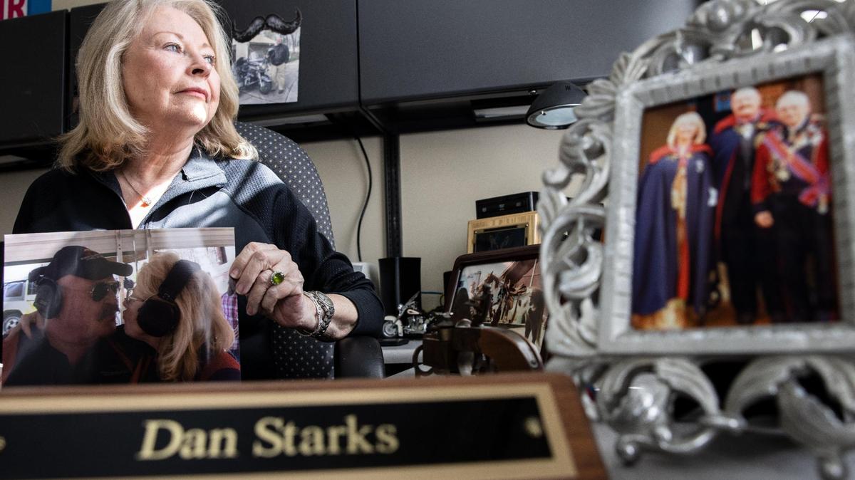 Connie Smigiel poses for a portrait with memories of her life partner, Dan Starks, in his office earlier this week. Dan Starks was a popular self defense teacher who had a TV show on WCNC.