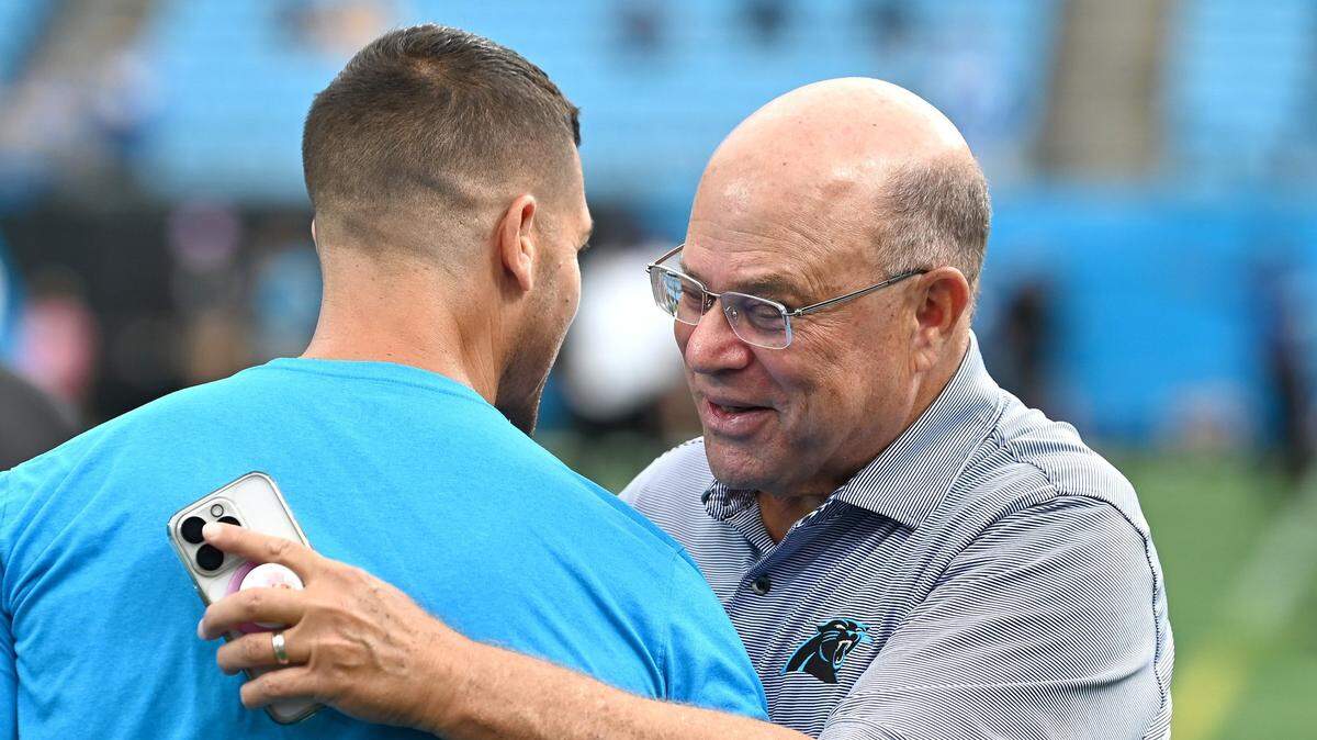 Carolina Panthers head coach Dave Canales, left, speaks with team owner David Tepper, right, prior to the team’s game against the Los Angeles Chargers on Sunday, September 15, 2024.