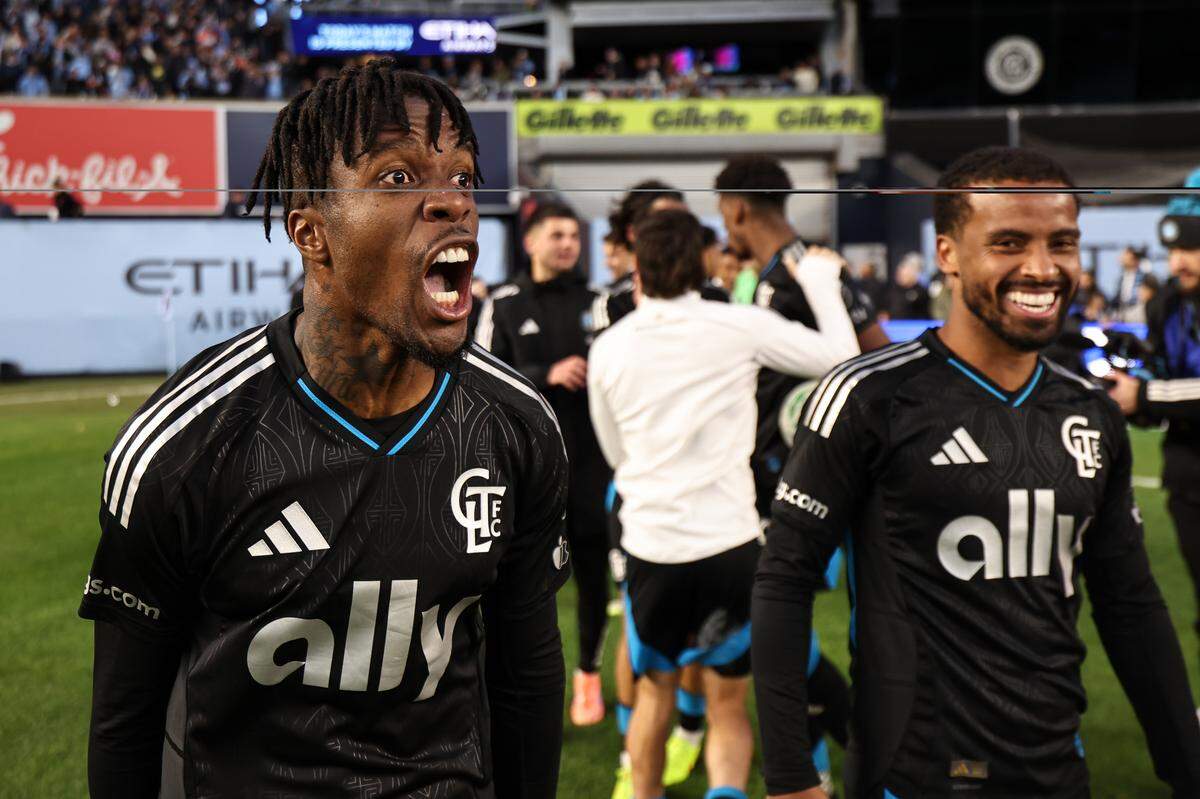 Wilfried Zaha of Charlotte FC celebrates after his team defeated New York City FC in a penalty shootout in the MLS Cup playoffs on Saturday at Yankee Stadium.