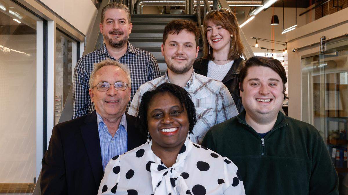 Charlotte Observer Executive Editor Rana Cash, front, is seen with the Observer public safety team at the newsroom’s Wilkinson Boulevard office on March 20, 2024. From left: Reporter Joe Marusak, public safety editor Patrick Wilson, reporter Ryan Oehrli, reporter Julia Coin and reporter Jeff A. Chamer