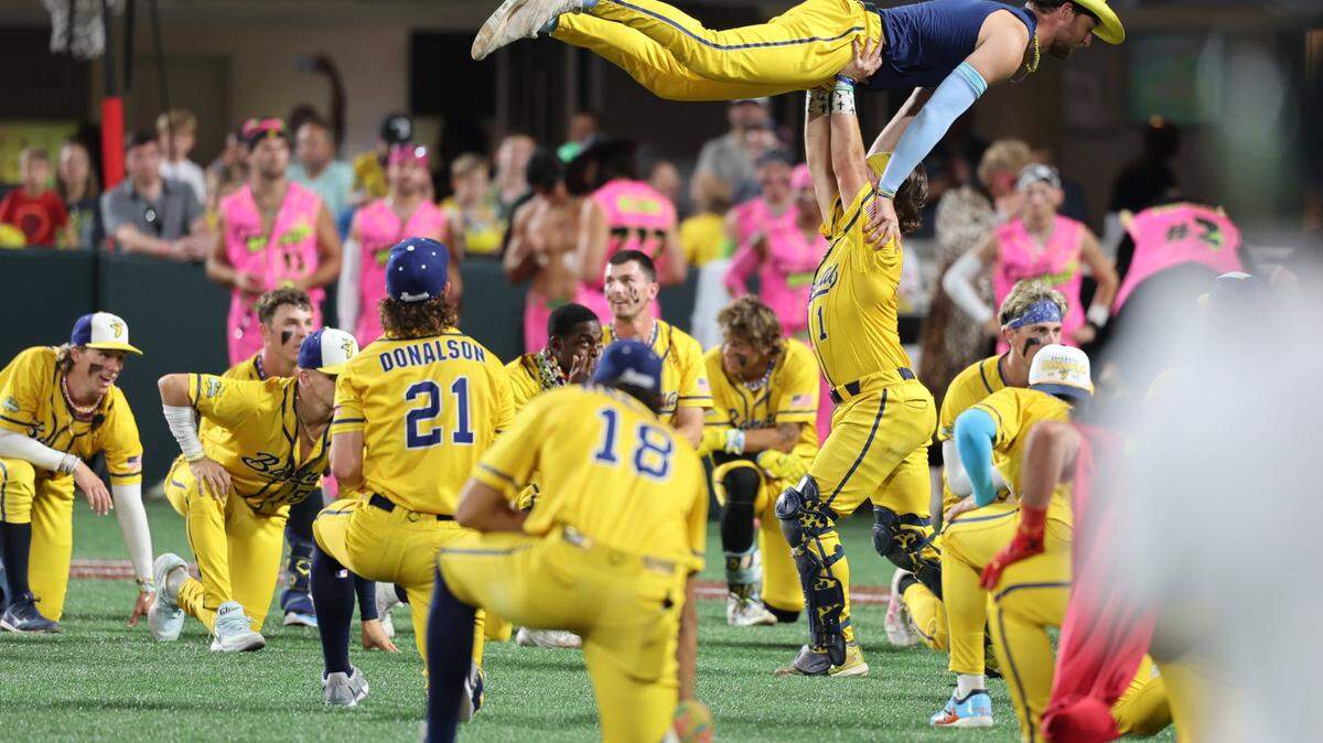 The Savannah Bananas celebrate their victory over the Party Animals at Bank of America Stadium in Charlotte on Friday, June 6, 2025.