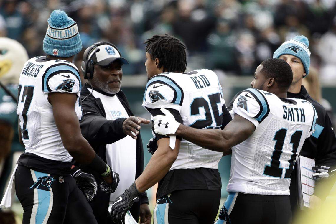 Carolina Panthers safety Eric Reid (25) is held back by wide receiver Torrey Smith (11) during an argument before Sunday’s game against the Philadelphia Eagles in Philadelphia.