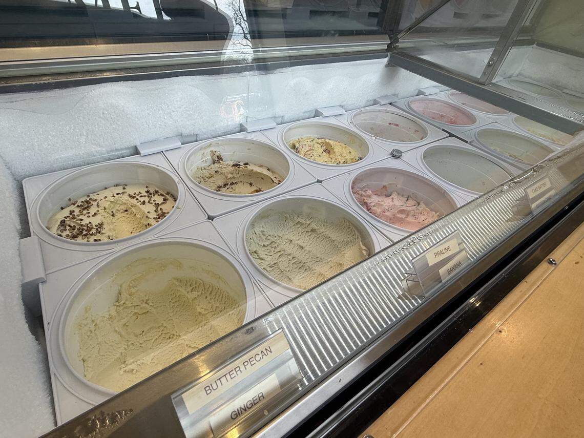 A close-up of a second display freezer featuring gourmet ice cream flavors like Butter Pecan, Praline, Banana, and Ginger.