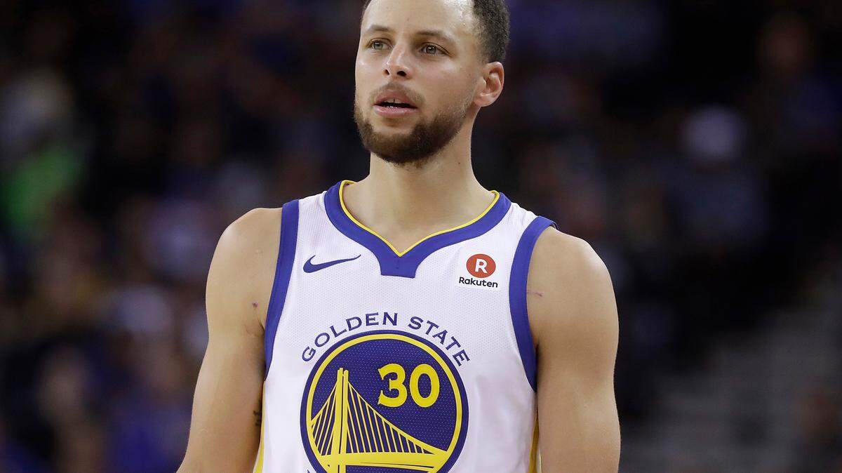 FILE - This March 6, 2018 file photo shows Golden State Warriors guard Stephen Curry during an NBA basketball game against the Brooklyn Nets in Oakland, Calif.  Sony Pictures Entertainment announced Monday, April 23, that it has struck a deal with the Golden State Warriors All-Star guard to produce television, film and possibly gaming projects. (AP Photo/Jeff Chiu, File)