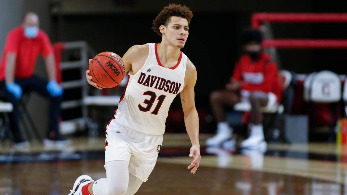 Davidson guard Kellan Grady brings the ball upcourt against Charlotte in the first half of a college basketball game in Davidson, N.C., Tuesday, Dec. 15, 2020.