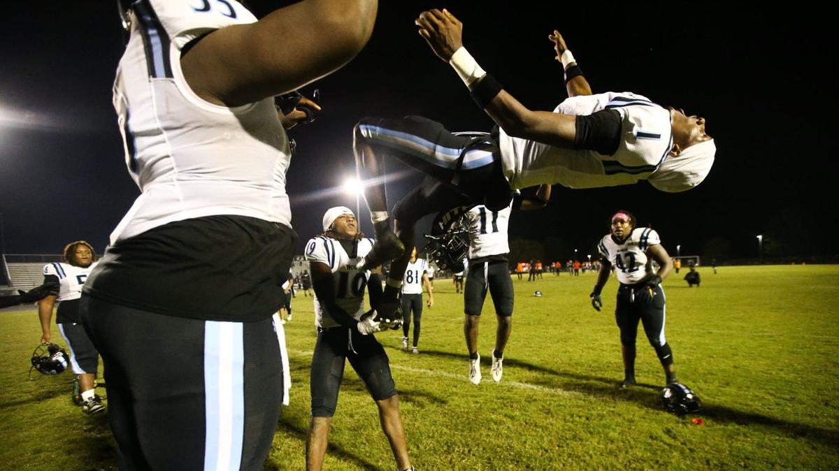 Hough senior Morgan Linton performs a backflip after the win against Chambers High School at Julius L. Chambers High School in Charlotte, NC on September 30, 2024.
