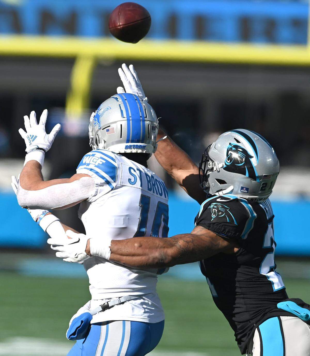 Carolina Panthers safety Jeremy Chinn, right, breaks up a pass meant for Detroit Lions wide receiver Amon-Ra St. Brown, left, during first quarter action at Bank of America Stadium on Saturday, December 24, 2022 in Charlotte, NC.