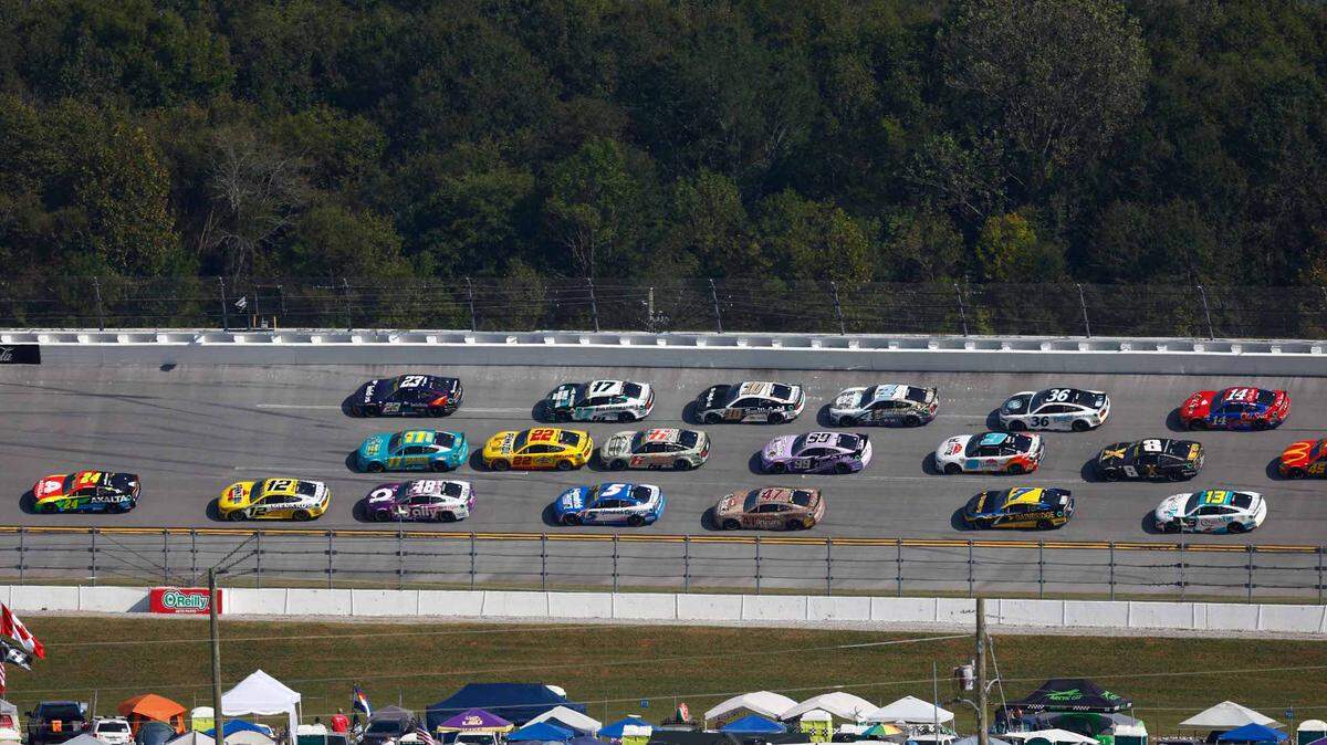 NASCAR Cup Series driver William Byron (24) leads the pack through turn two during the YellaWood 500 at Talladega Superspeedway. 
