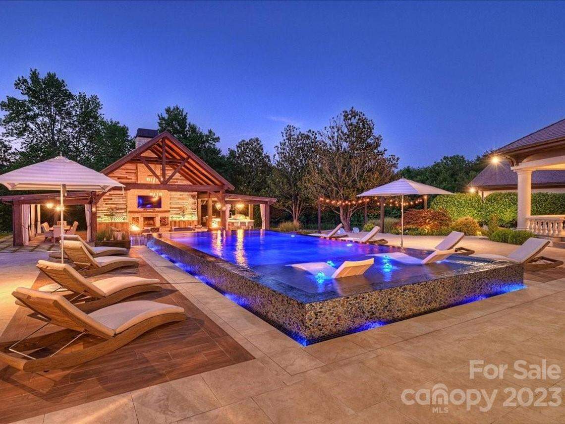 Shown is the outdoor pool area of the home.