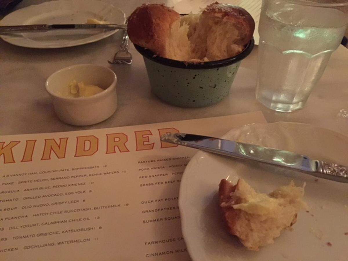 The warm milk bread at Kindred is free for the first taste. After that, you have to pay $5.