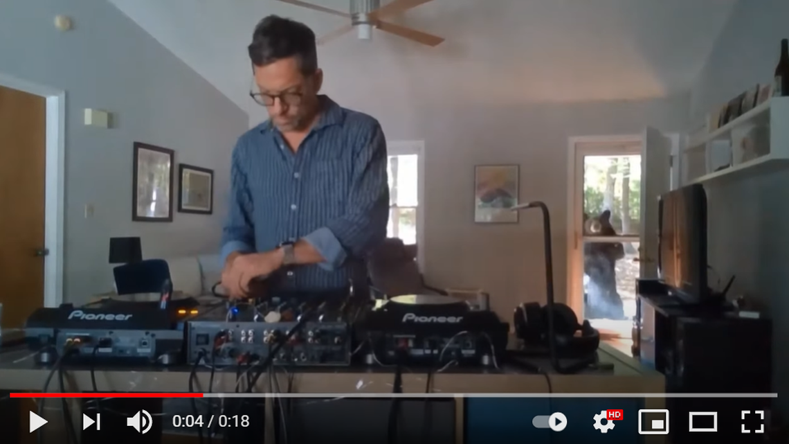 A black bear sneaks up on a part-time DJ during a set at his North Carolina home.
