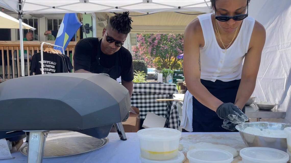 Kerrel and Nkem Thompson make pizzas at a July 2021 pop-up at Crafty Beer Guys in Huntersville.