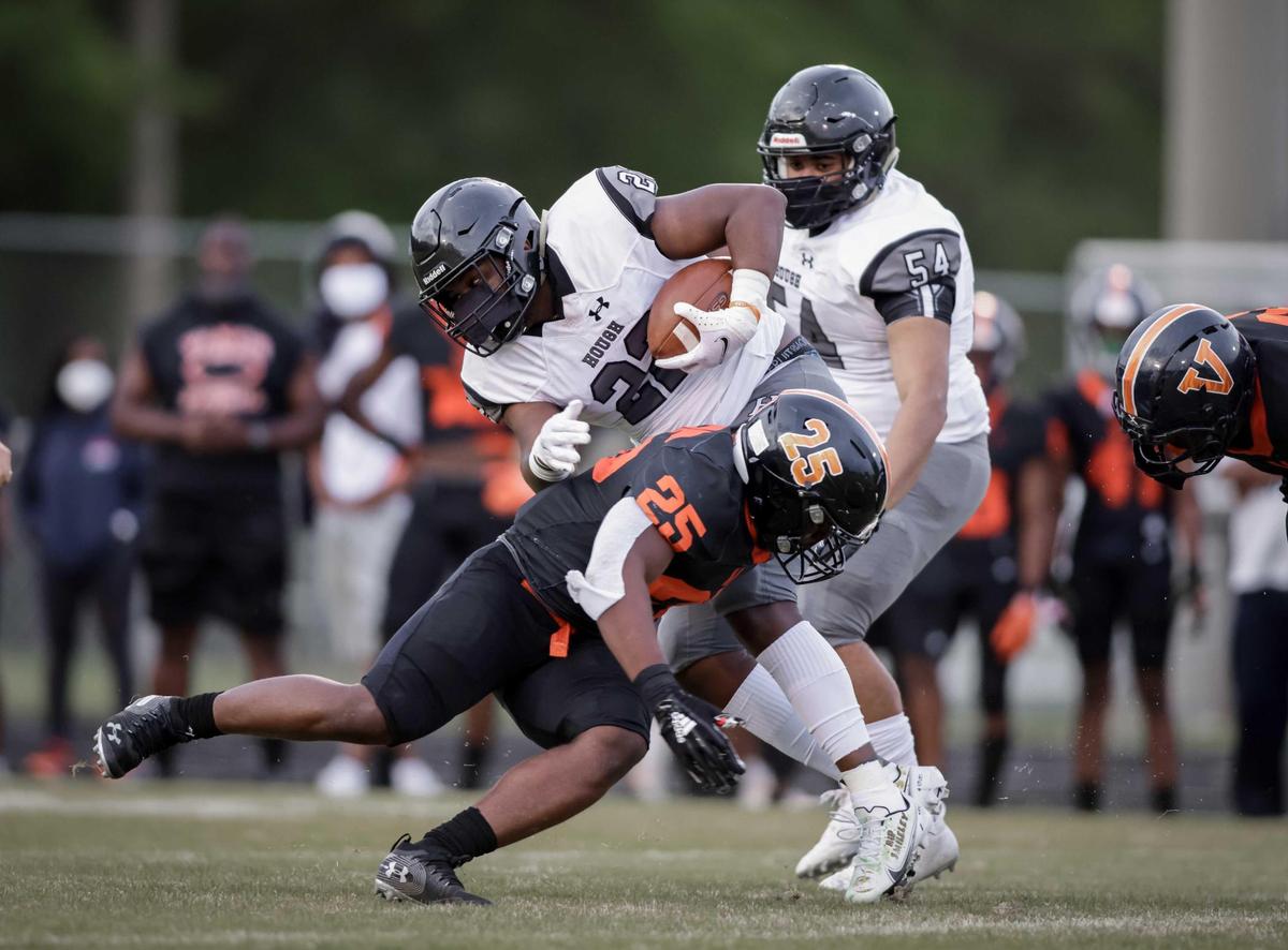 Vance Cougar Jordan Thompson (25) gets the tackle. Hough Huskie Jacquon Gibson (10) catches the deep pass for the 1st down. The Hough Huskies win the I-MECK 4A championship 29-22 vs the Vance Cougars Friday April 9, 2021.