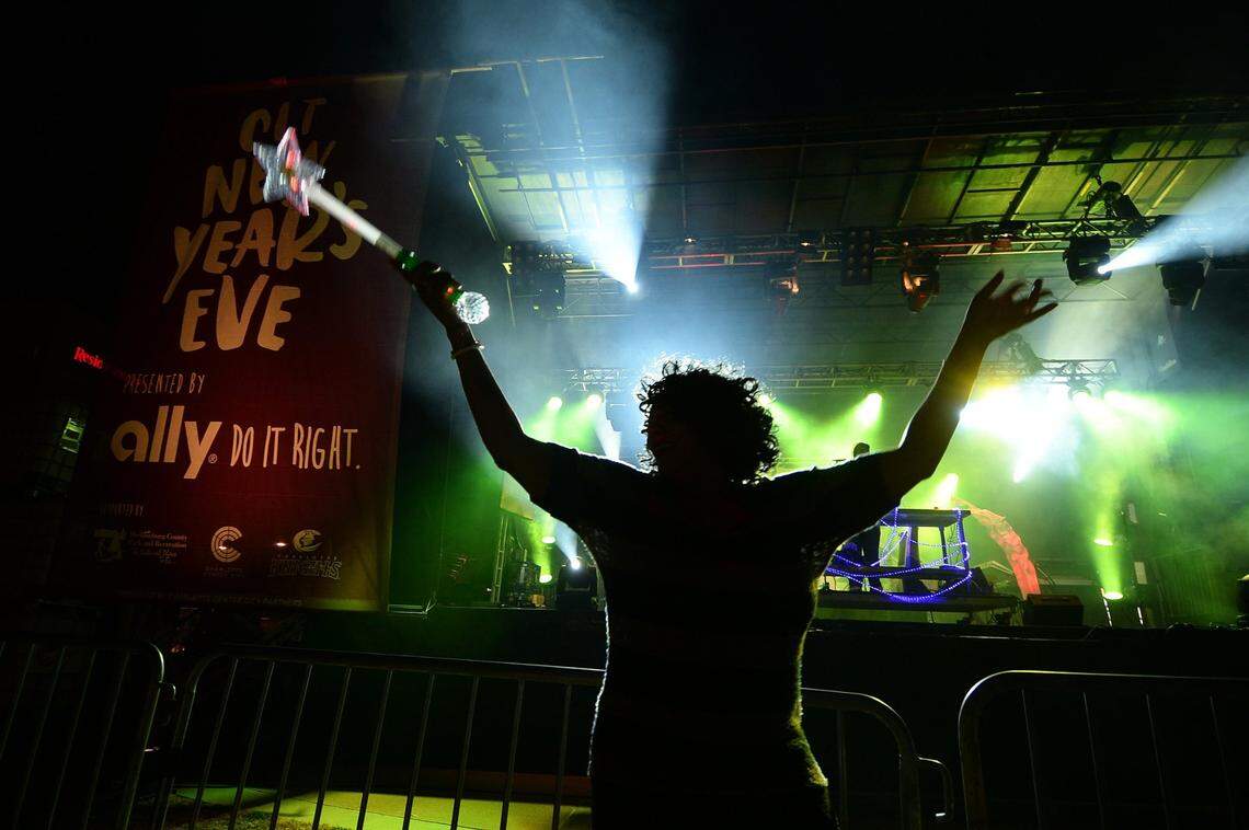 Sherry Phillips dances DJ Rayon during Charlotte’s New Year’s Eve celebration at Romare Bearen Park on Dec. 31, 2016. 