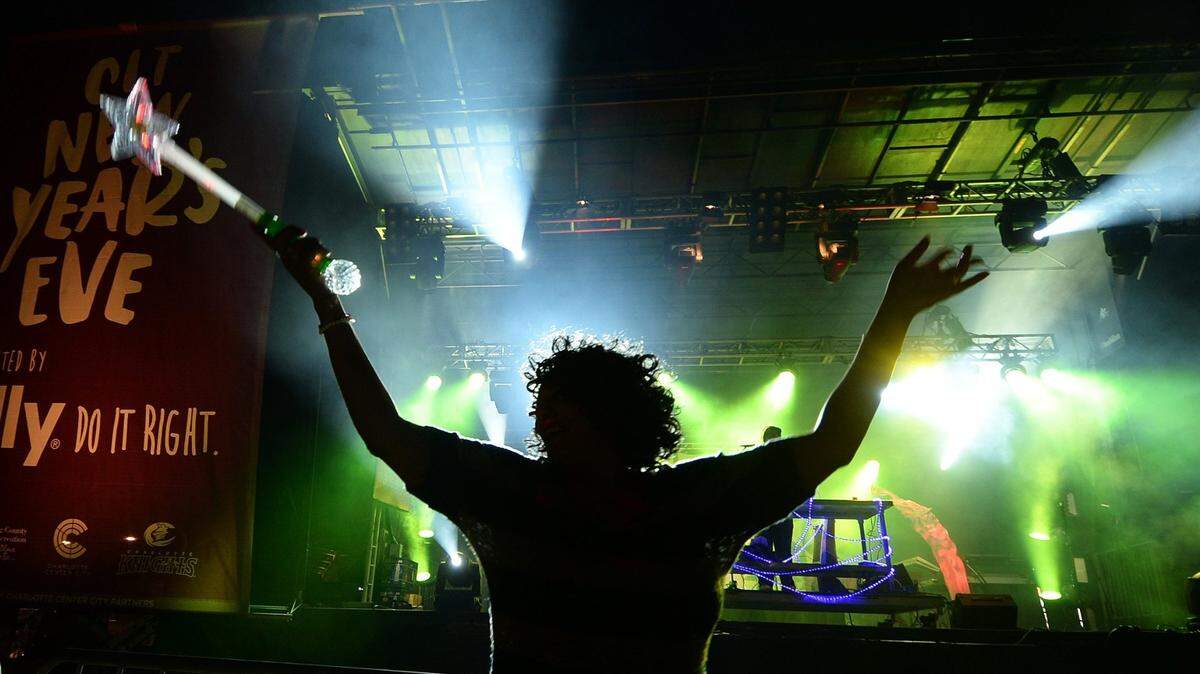 Sherry Phillips dances DJ Rayon during Charlotte’s New Year’s Eve celebration at Romare Bearden Park on Dec. 31, 2016. After a one-year absence, the uptown party will return to ring in 2022 at South Tryon Street at Levine Avenue of the Arts.