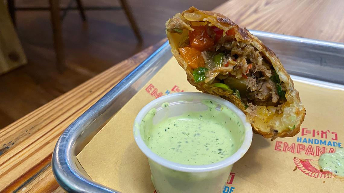 The pulled chorizo empanada at Felix Empanadas comes with a cilantro dipping sauce.