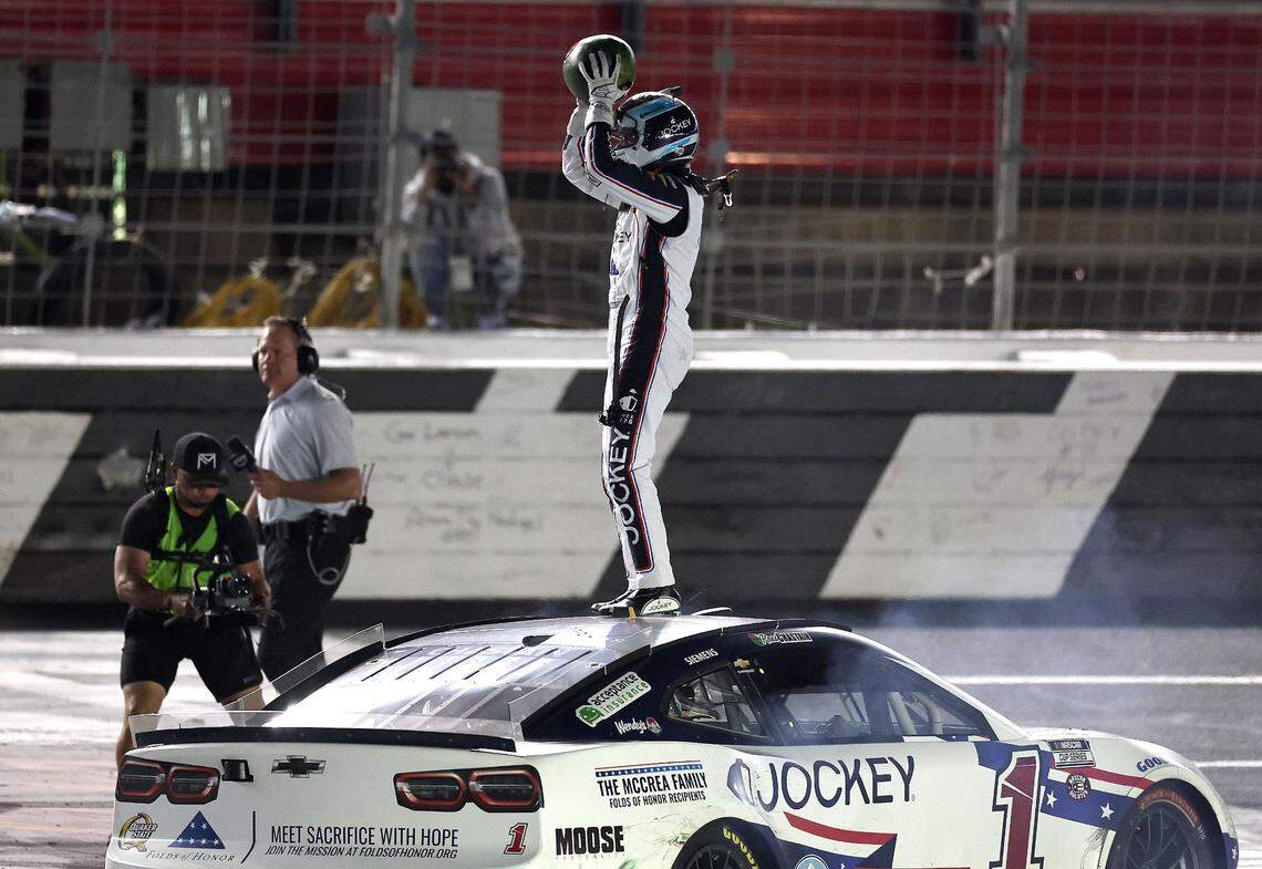 NASCAR Cup Series driver Ross Chastain prepares to smash a watermelon from atop his car after winning Sunday’s Coca-Cola 600 at Charlotte Motor Speedway in Concord.