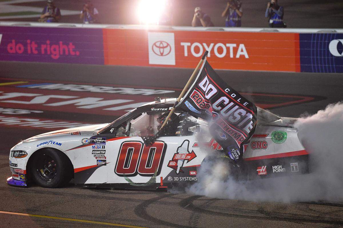 Nov 4, 2023; Avondale, Arizona, USA; NASCAR Xfinity Series driver Cole Custer (00). celebrates his championship victory following the Xfinity Championship Race at Phoenix Raceway.