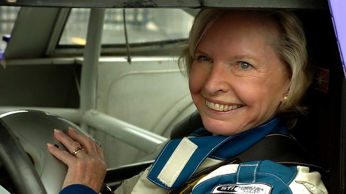 In 2006, Janet Guthrie smiles after climbing into a car to drive ceremonial laps around Charlotte Motor Speedway to commemorate the 30th anniversary of her having raced in what was then known as the World 600 at the track. Guthrie will be honored Friday for her contributions to NASCAR during the latest hall of fame induction ceremony in Charlotte.