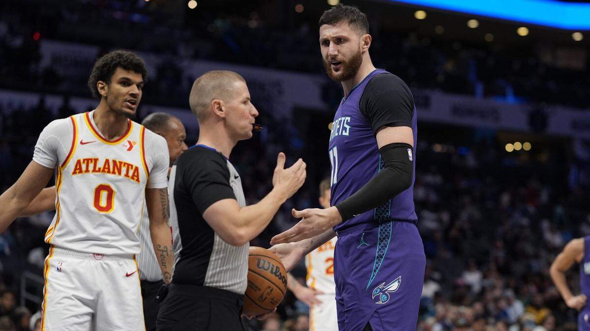 Charlotte Hornets center Jusuf Nurkic (11) argues with referee Tyler Ford (39) during second half against the Atlanta Hawks at Spectrum Center.