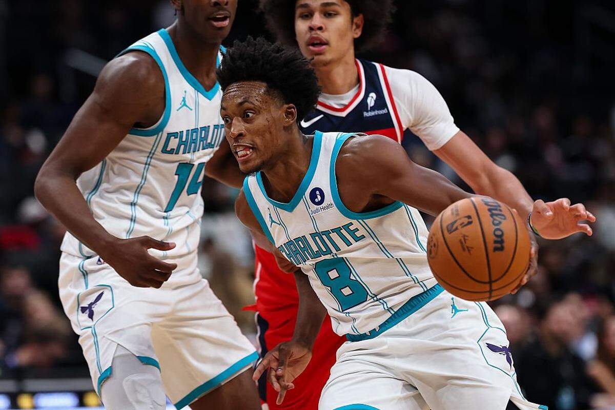 Collin Sexton (8) of the Charlotte Hornets drives to the basket against the Washington Wizards during the first half at Capital One Arena on October 26, 2025 in Washington, DC.