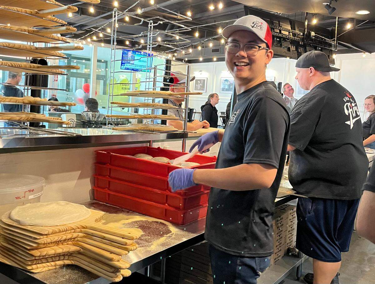 Workers prep for the lunch rush at King of Fire.