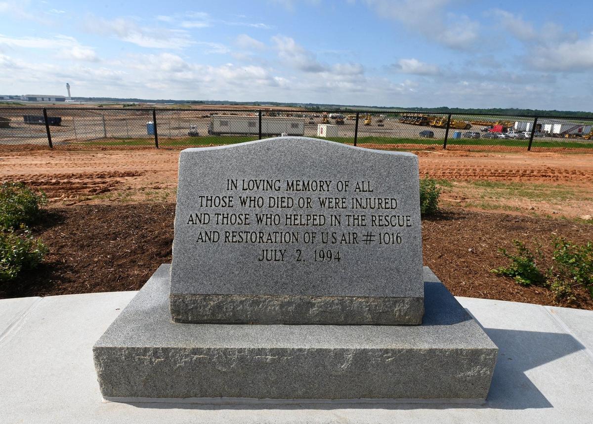 A memorial to those who died, were injured and provided rescue services for the US Air plane that crashed in Charlotte in 1994, killing 37 people, are honored at the new Charlotte Airport Overlook.