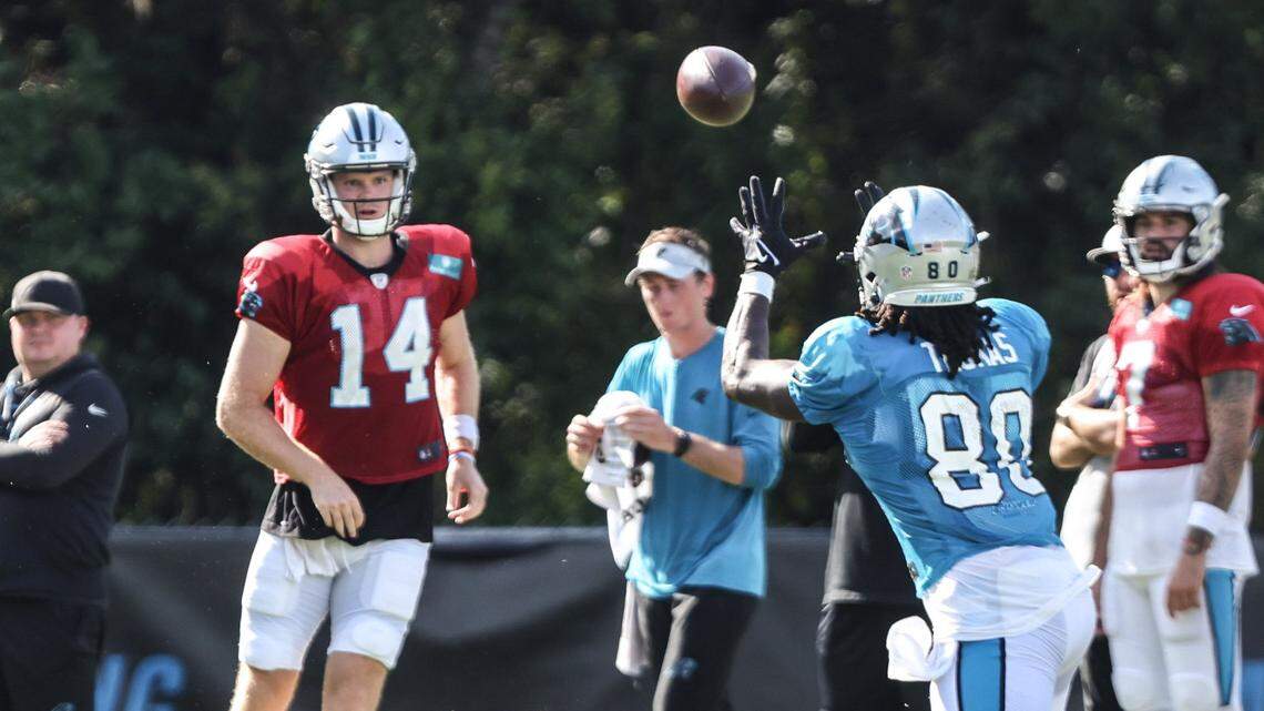 Carolina Panthers Sam Darnold, left, passes to Ian Thomas during the joint practice with the Baltimore Ravens in Spartanburg, S.C., last August. Darnold had his best practice in a Panthers uniform Wednesday, coach Matt Rhule said.
